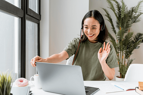 woman-with-headset-having-video-call-laptop